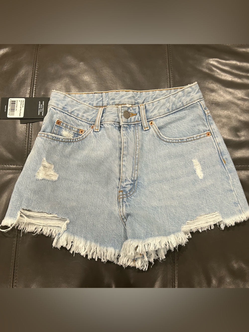 High-Rise Light Blue Distressed Denim Shorts with Frayed Hem